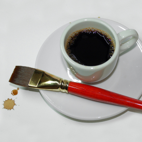 A photo of a cup of espresso and one of Steven Mikel's paint brushes - Dark Roast Watercolors, Painting with Coffee