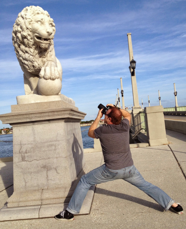 Photo of Steven Mikel taking the shot he used as reference for his coffee painting entitled: Protecting the bridge